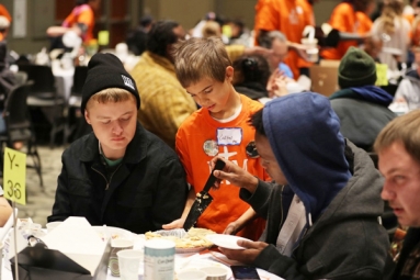 Boy, 8 serves homeless on Thanksgiving to honor his big sister!