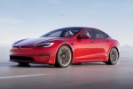 Tesla new electric car pictures, Tesla new electric car leaked, tesla to launch electric hatchback without a steering wheel, Tesla car